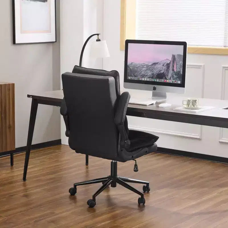 Fauteuil pivotant d'intérieur en similicuir noir avec dossier capitonné à clous et tirettes