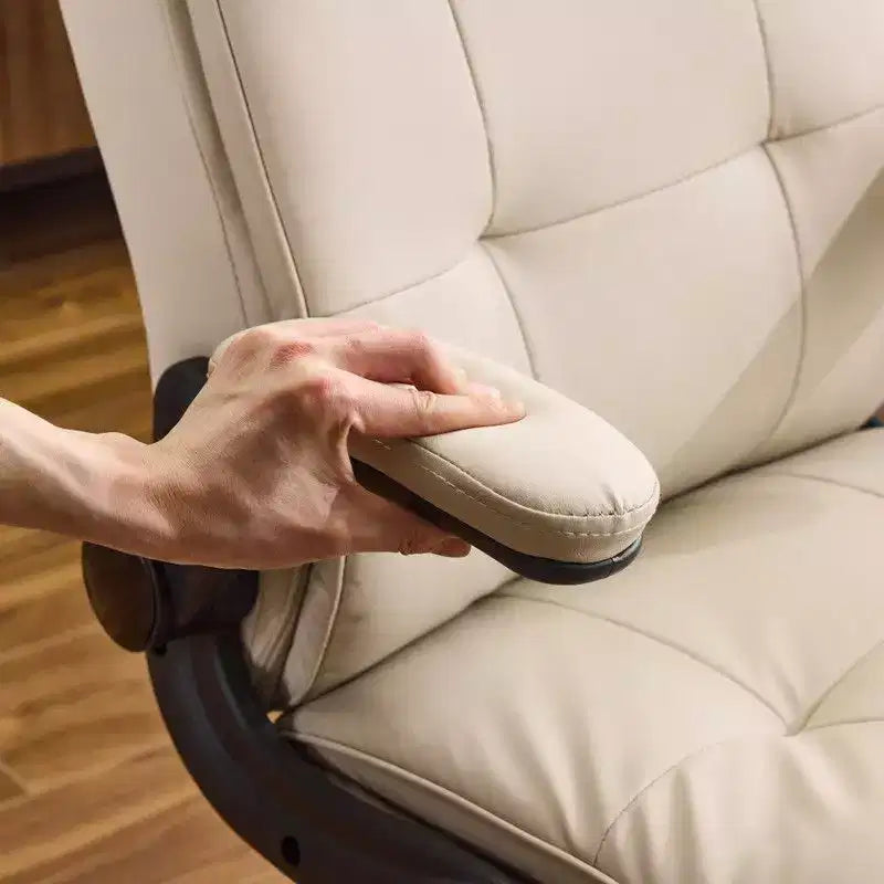 Fauteuil pivotant d'intérieur en similicuir noir avec dossier capitonné à clous et tirettes